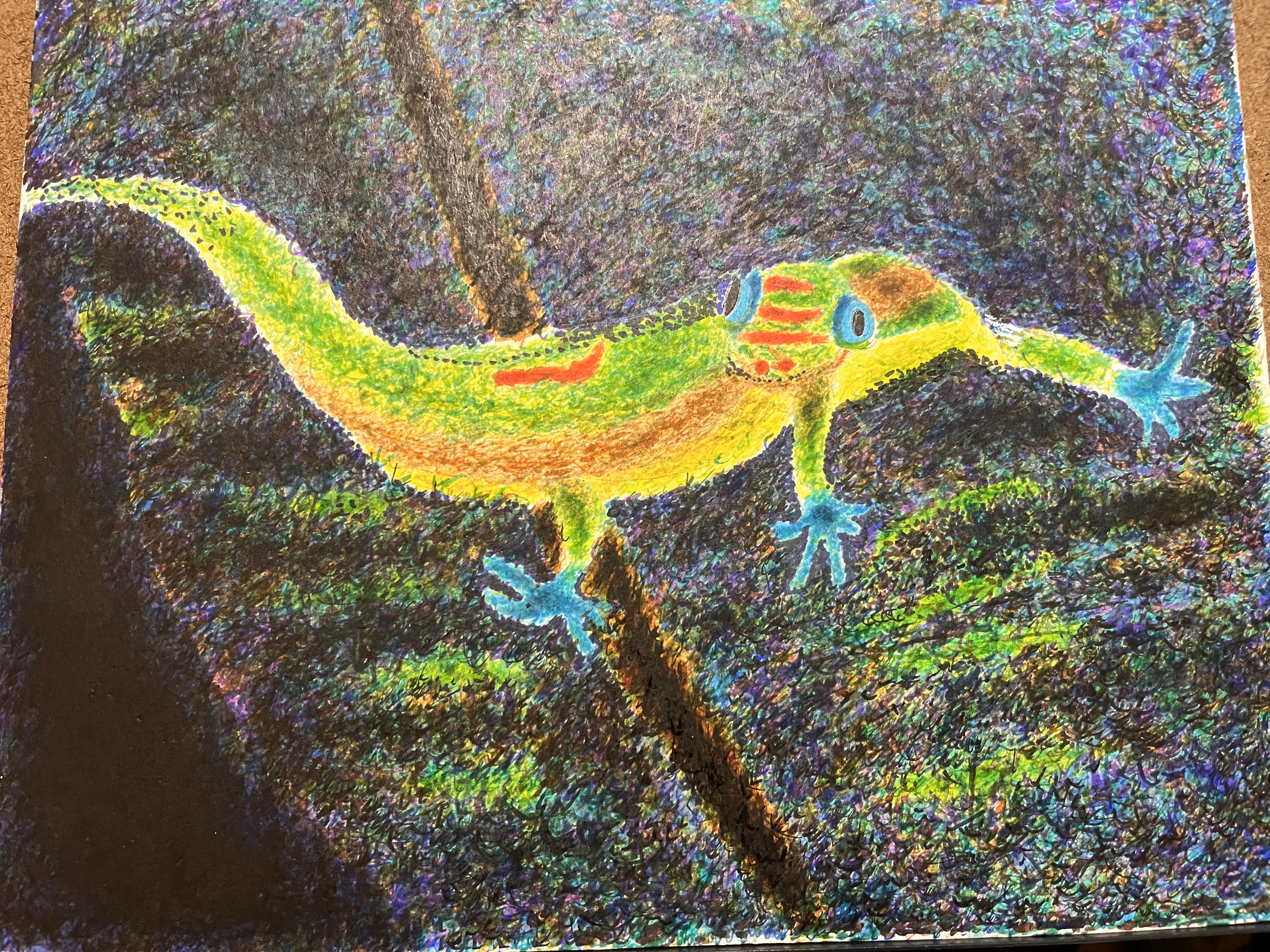 A gold dust gecko on a leaf